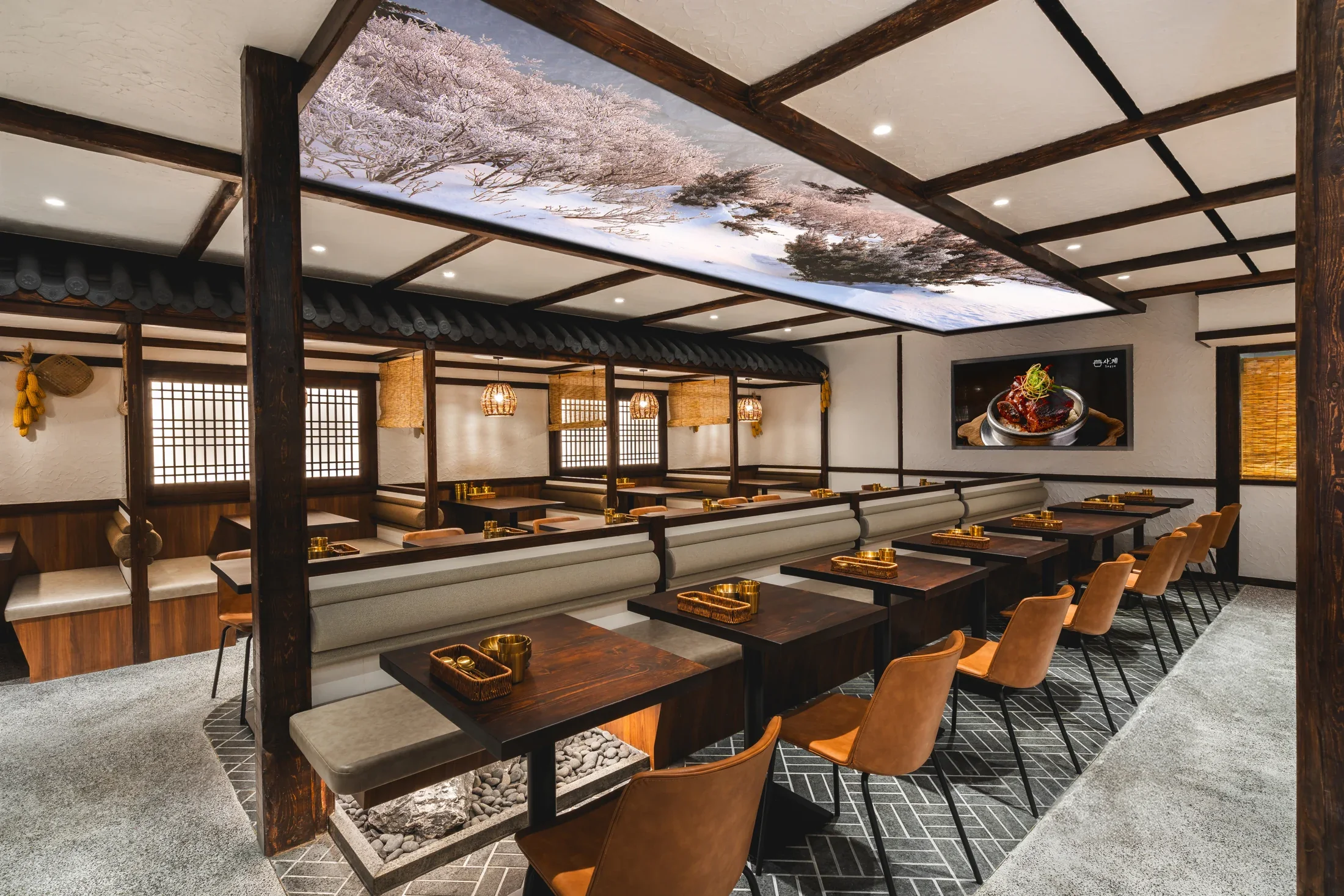 Warm wood tables and Korean architectural details in Sagye’s Wheelock dining room